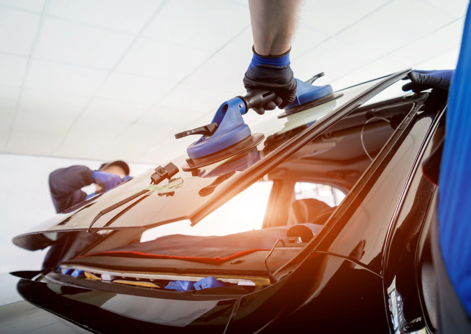 a person is lifting the cars glass